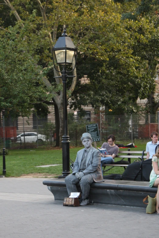 a man with a beard is sitting on a bench