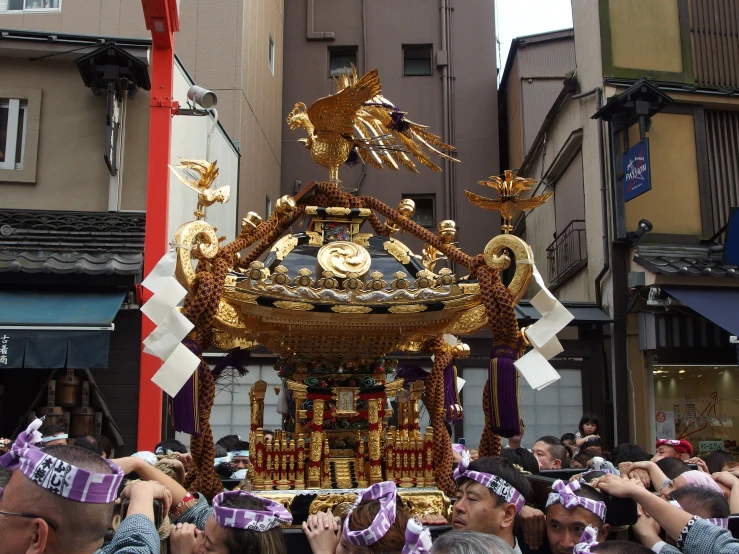 a float is in the middle of a crowded street