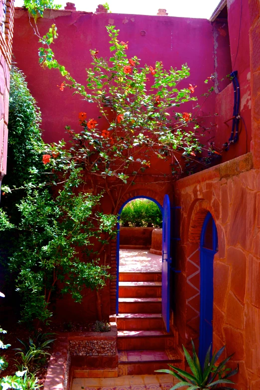 a view of an alleyway with colorful architecture