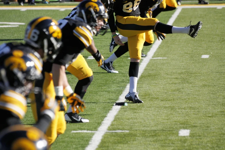 a football player is running with his foot in the air