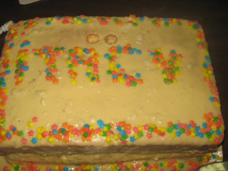 a large cake decorated with various toppings and some frosting