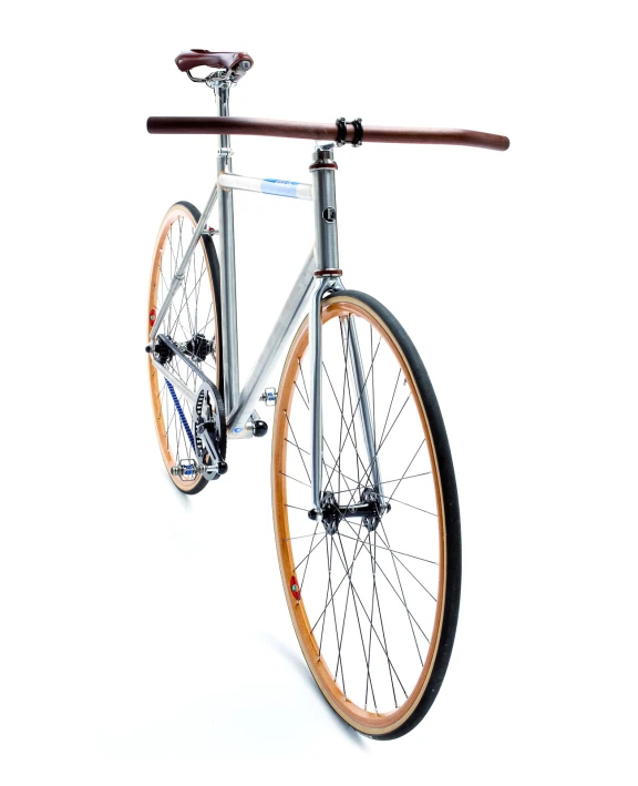 an old bicycle that is parked against a white background