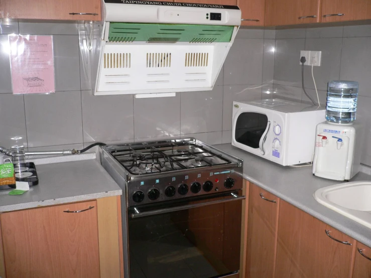 an oven and microwave combination in a kitchen