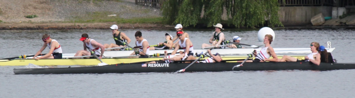 a long canoe with a group of people on top of it