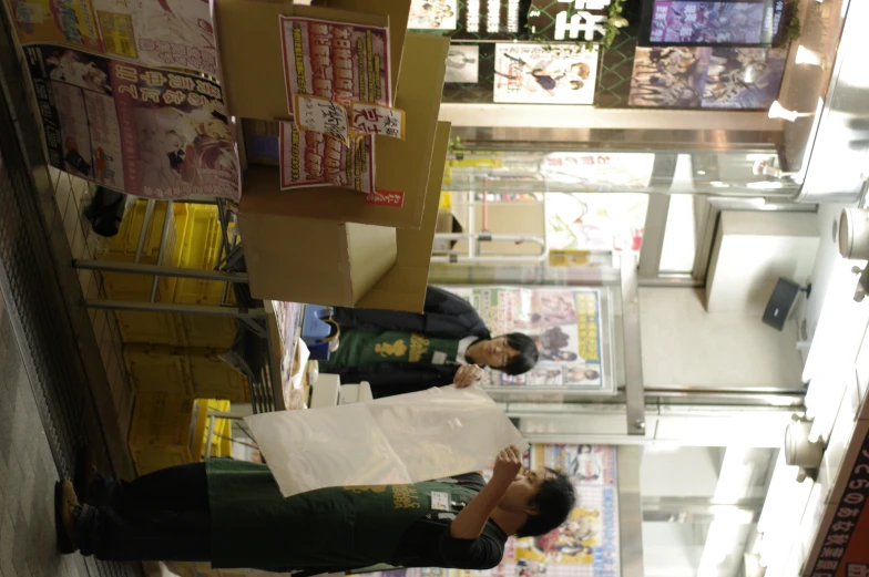 two asian men outside of an outdoor store