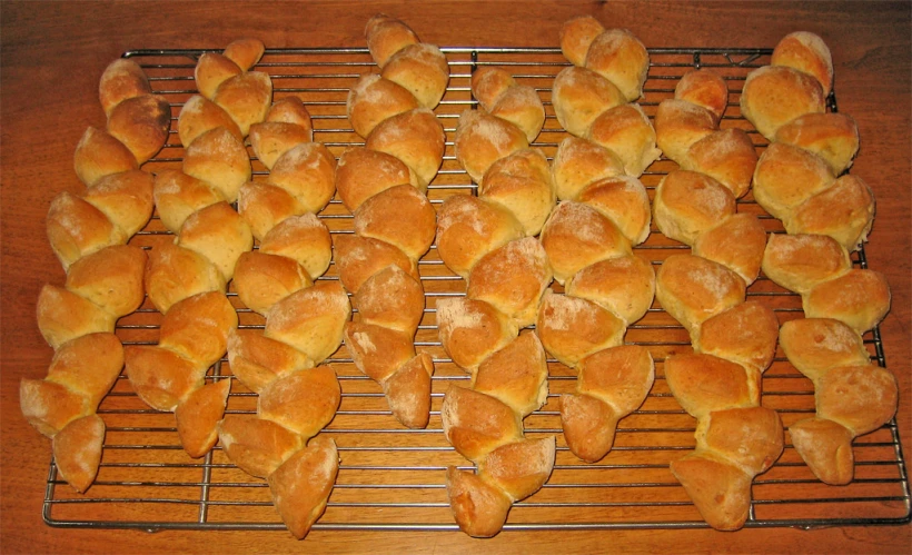 a table is filled with bread bites on a rack