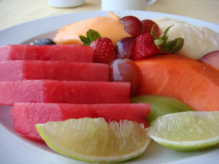 various fruit with one slice cut and some half cut