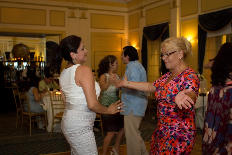 a couple of women standing next to each other near each other