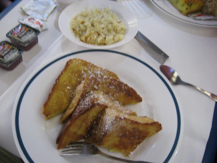 some food on a plate and some forks