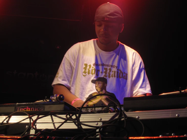 a man is playing with a keyboard at a concert