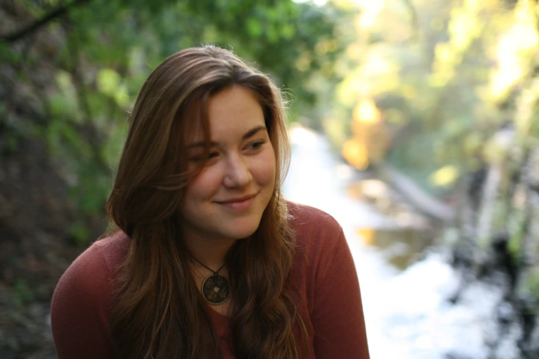 a woman looking straight ahead and smiling at the camera