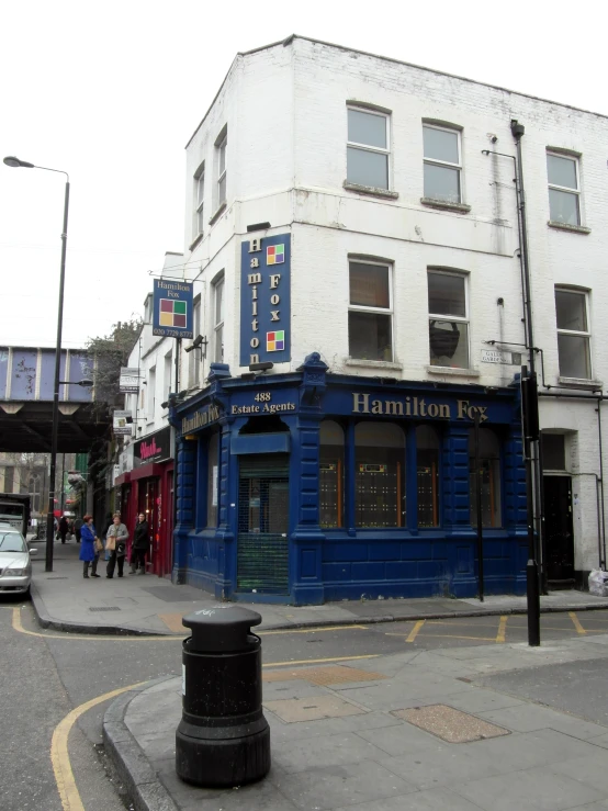 the corner is a shaded and empty street