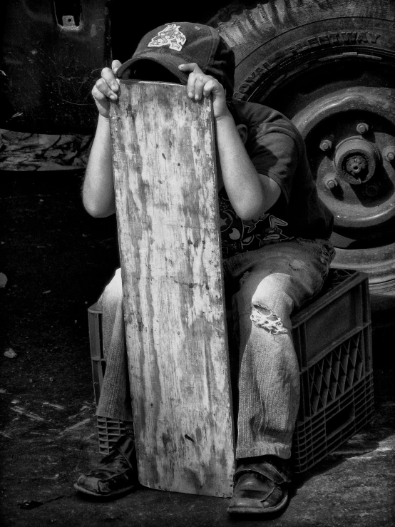 a young person sitting on the back of a truck