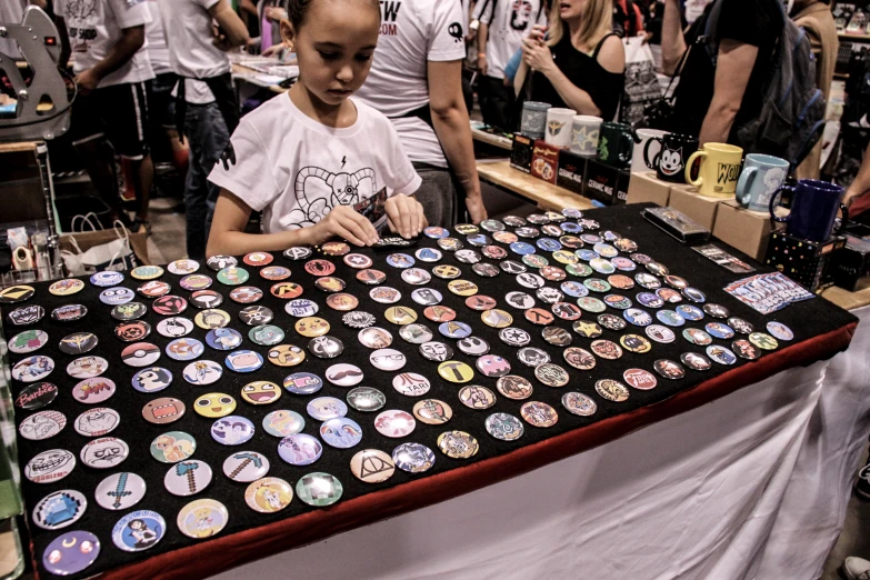 people looking at and inspecting souvenir items