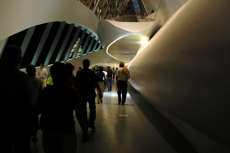 some people walking along in a tunnel