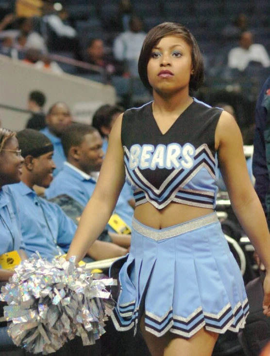 a cheerleader walks on the court during a game