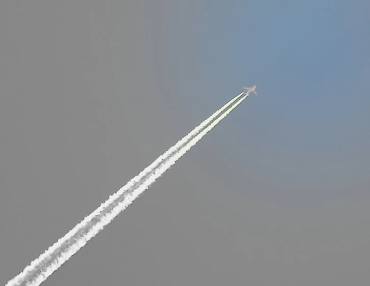 there are two jet planes in the sky