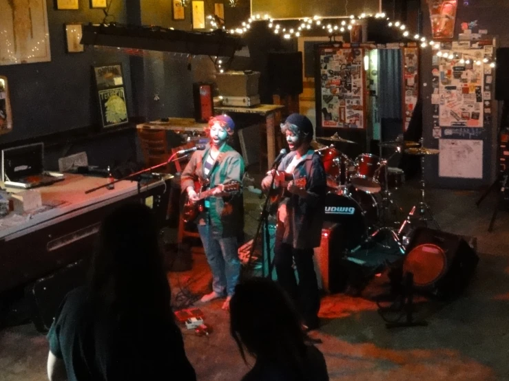 a band playing instruments at an outdoor music venue