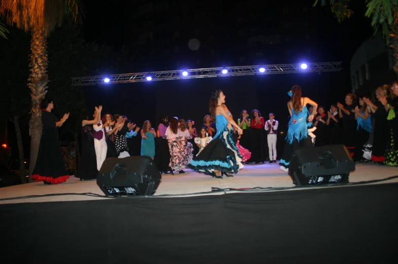 a group of people standing on top of a stage