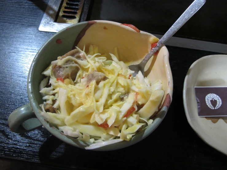 a bowl of food sitting on top of a table