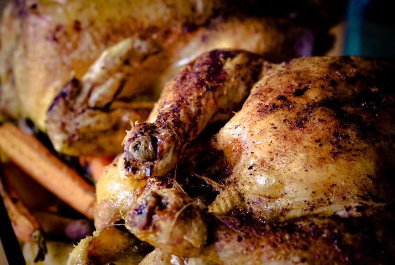 a chicken sitting on top of an assortment of cut up vegetables