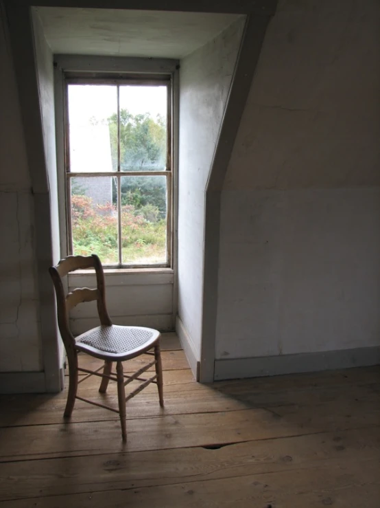 a chair sitting in the corner of a room