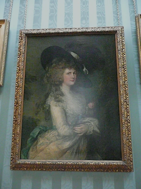 a painting hanging on the wall, painted in a museum setting