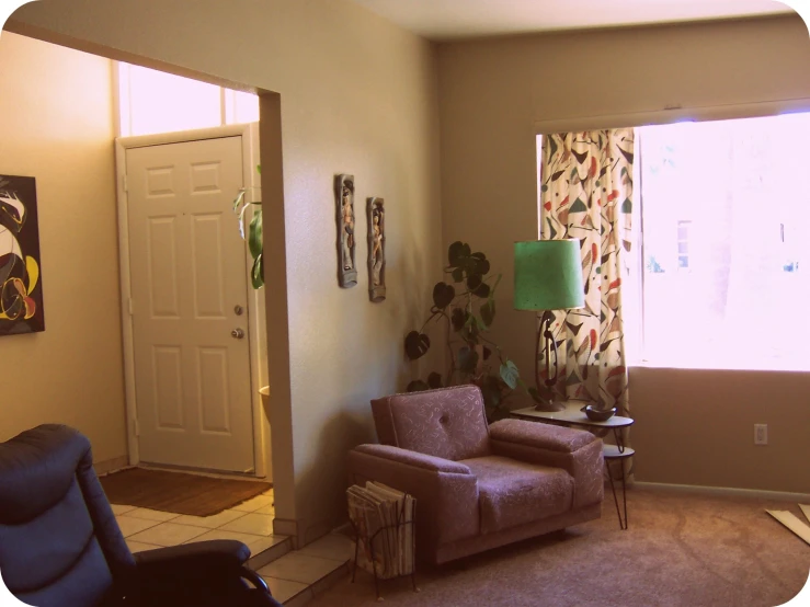 a room is shown with a chair and lamps