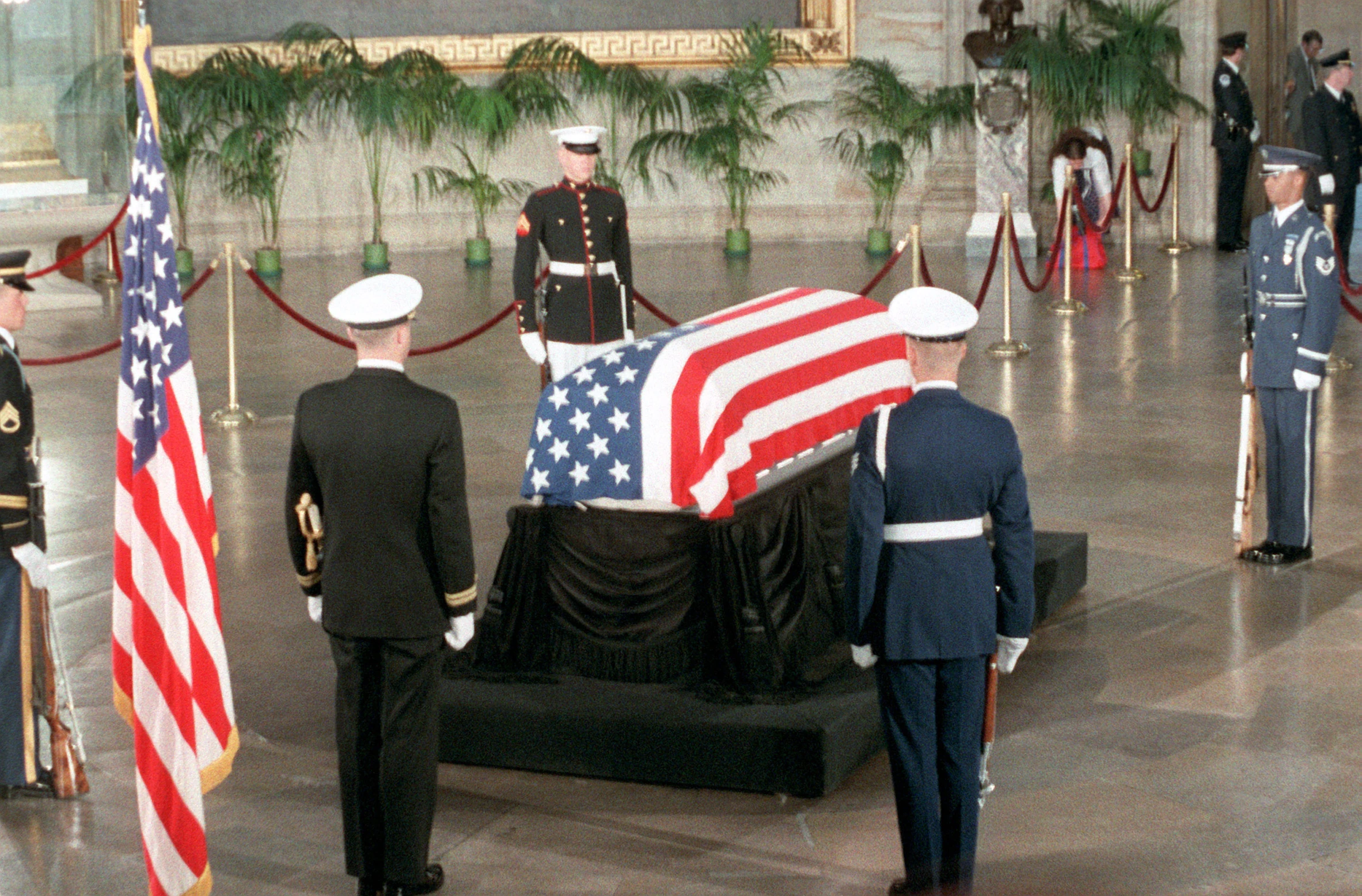 some military men are being presented with a flag