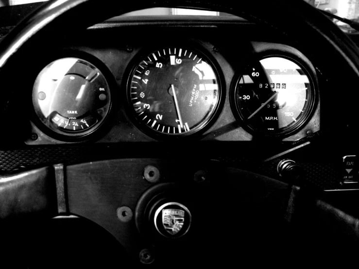 three gauges and a clock on a car dashboard