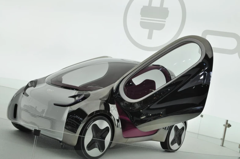 a futuristic car with a door open sitting on display