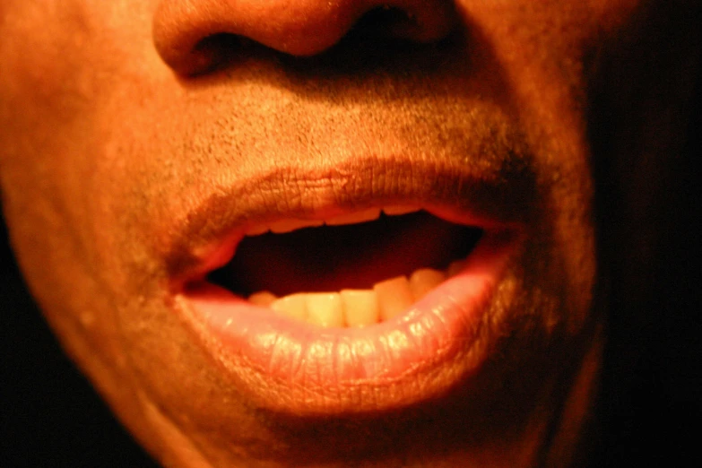 an image of a person with a toothbrush in the mouth