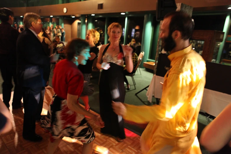 people dancing with motion controlled lightening effects in a bar