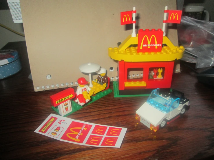 the mcdonalds playset is set up with some little toy cars