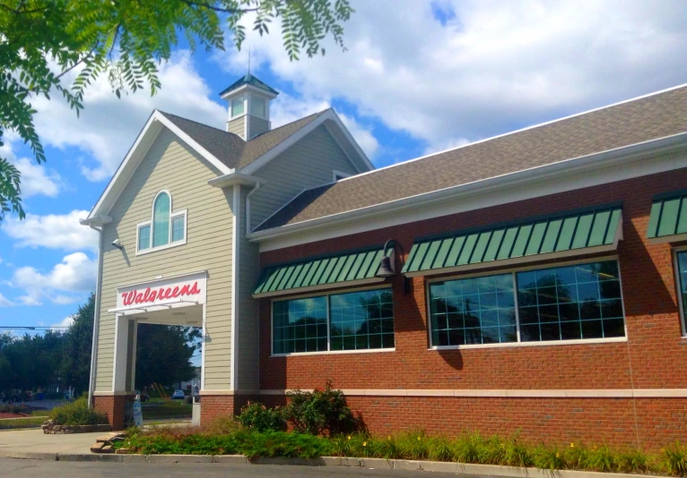 the front of an upscale restaurant with a clock tower