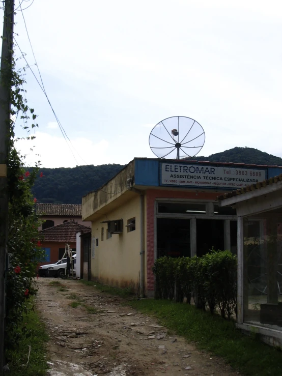 old fashioned building with satellite dish in a small street