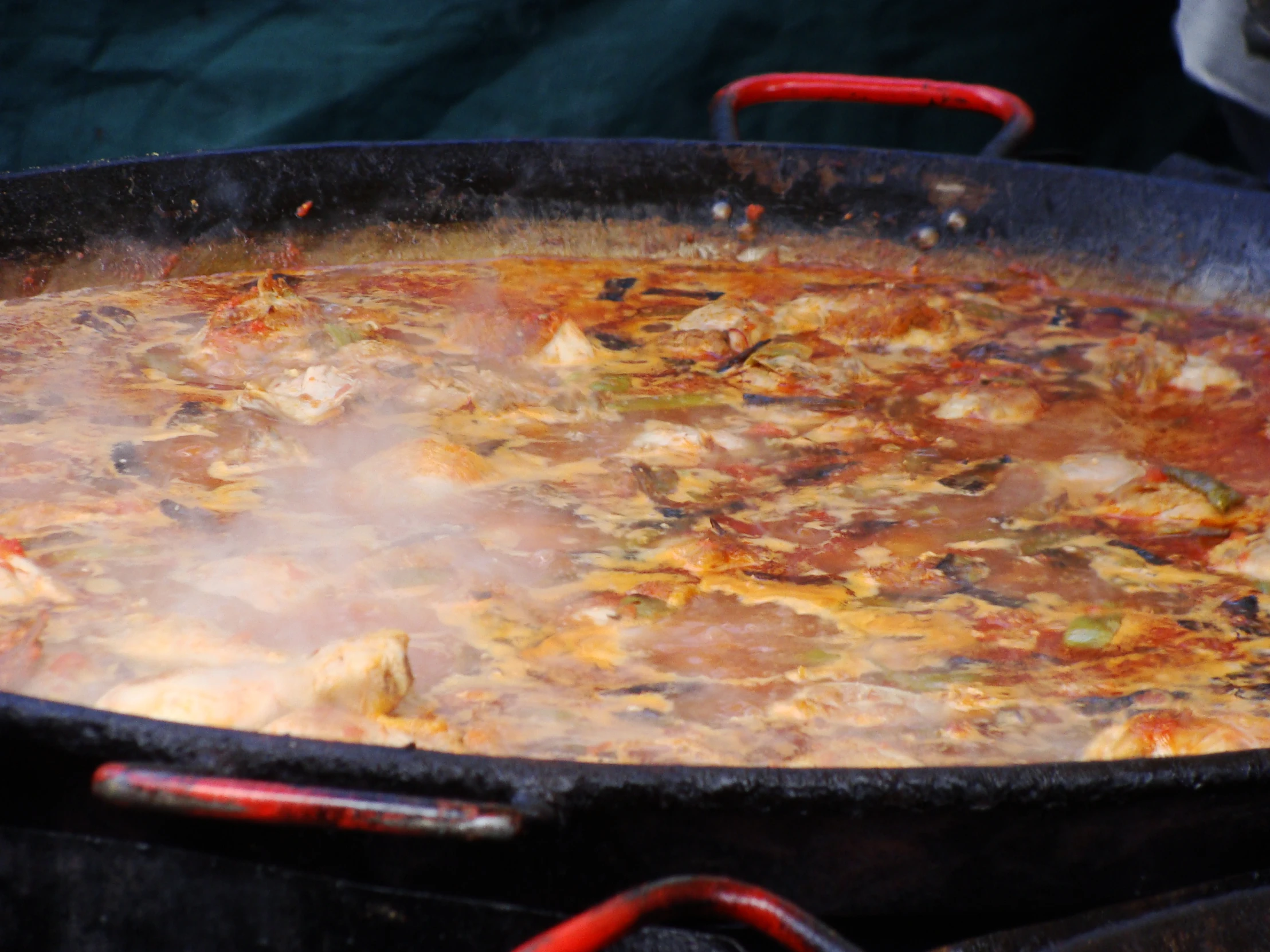 cooked meat in an iron set cooking