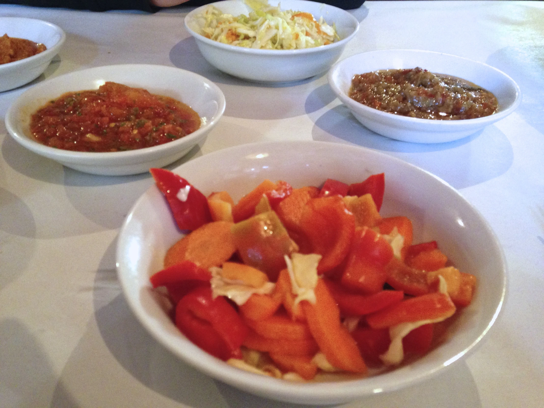 bowls of vegetables and rice on a table