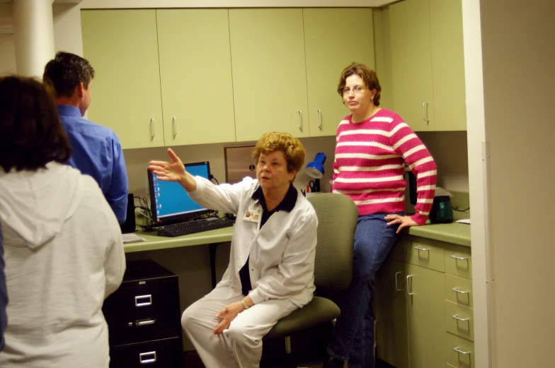 a group of people in an office talking