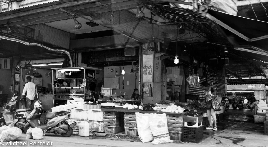 the front of a large outdoor market in an old china town