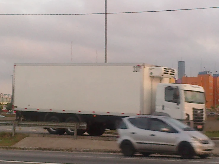 an image of truck going down the road