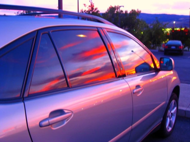 this is the reflection of sunset in the windows of a car