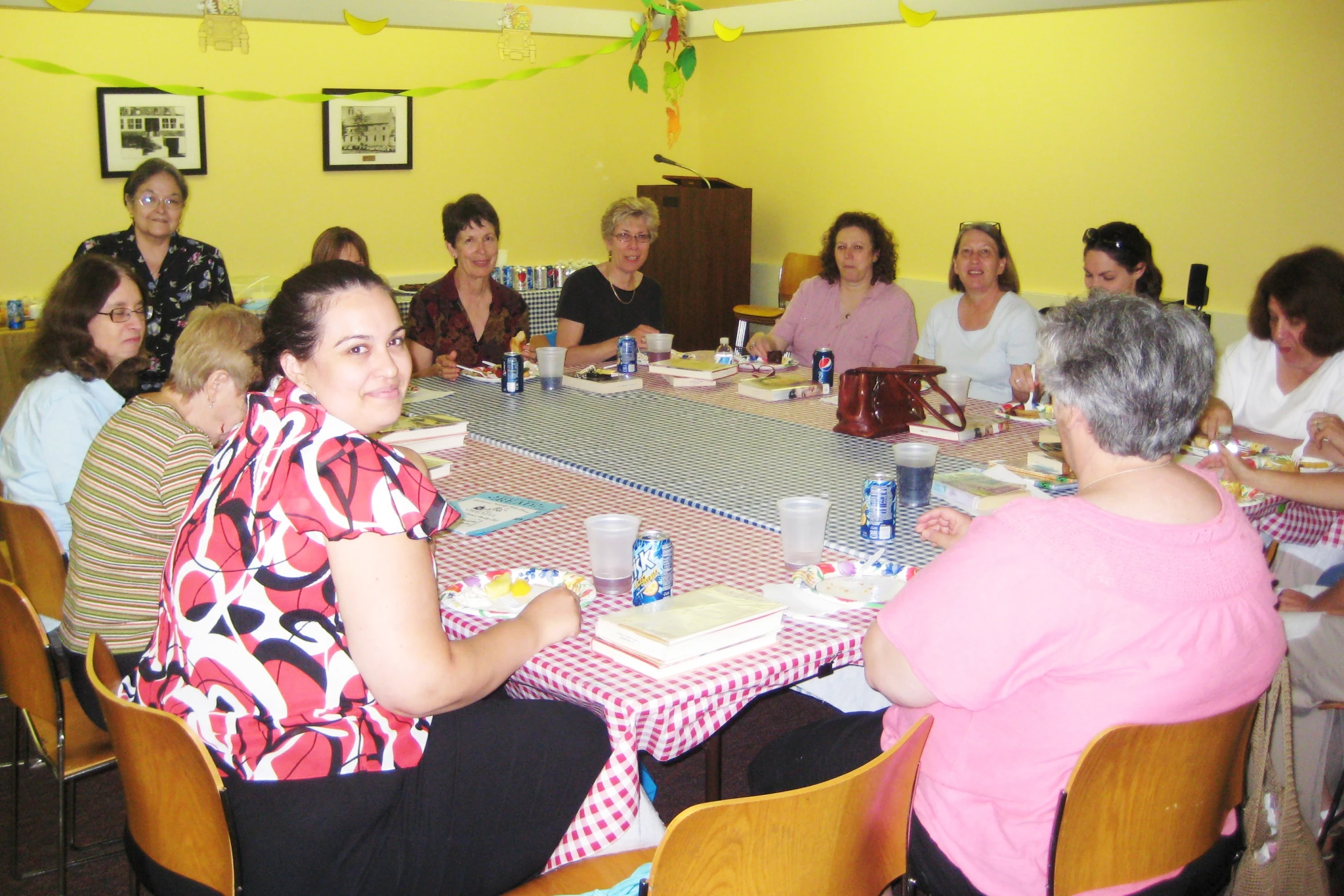 several people sitting around a dining table together