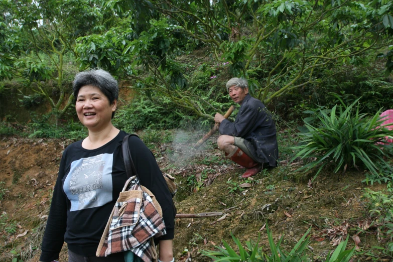 a woman standing on top of a lush green field