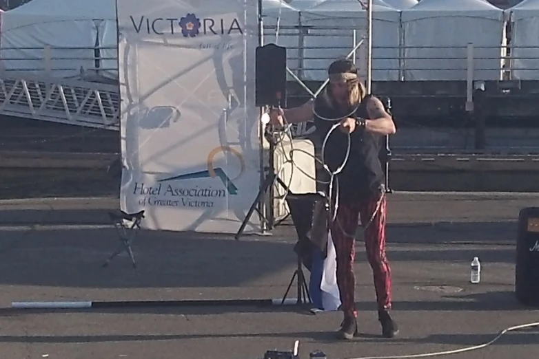 two men performing at a festival with ropes in hand