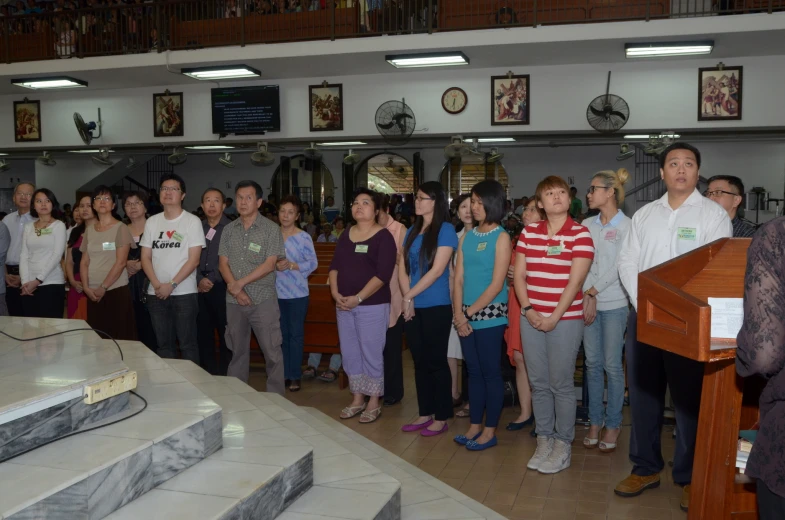 group of people gathered for a mass in church