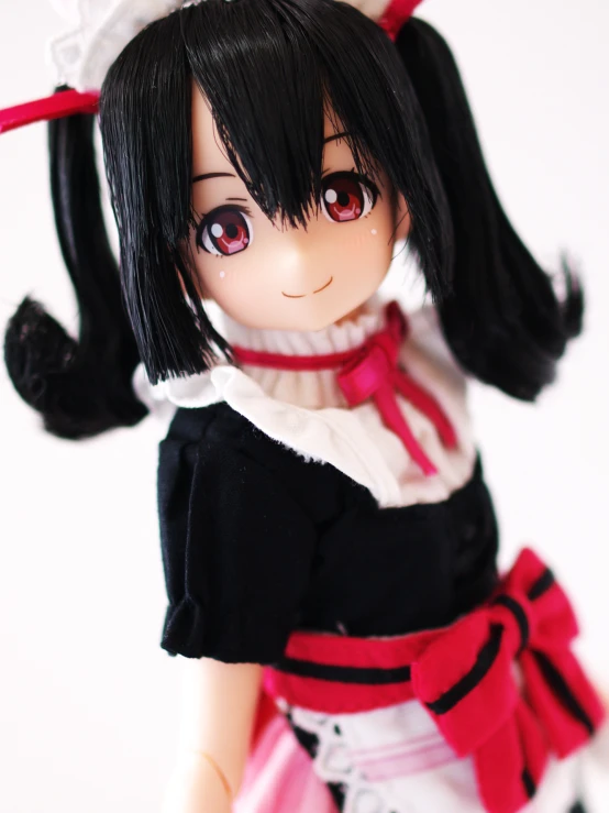 the doll is dressed in a japanese style costume