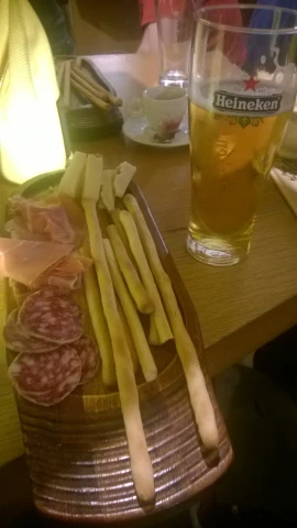 some appetizers and beer are on a table