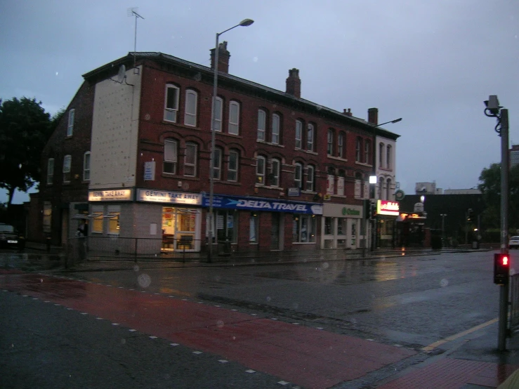 a rainy evening on the corner of a street