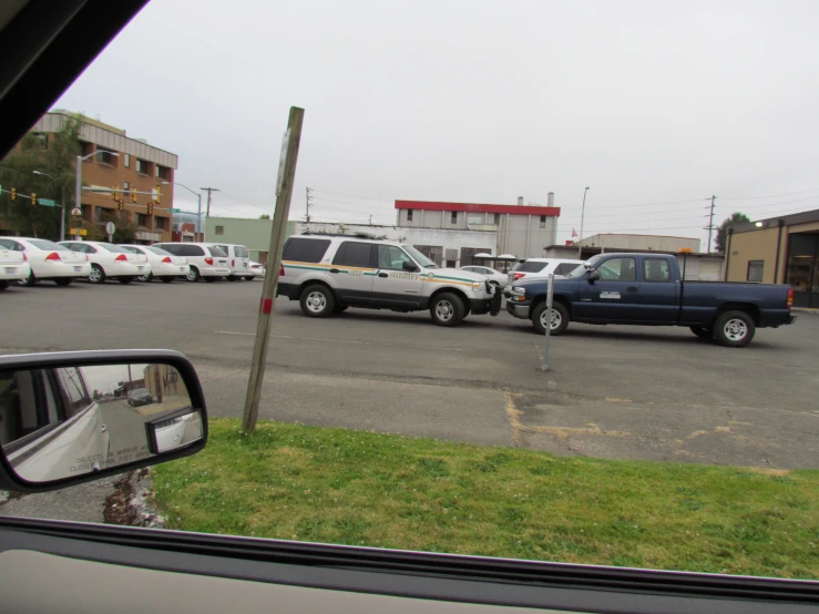 several cars are parked next to each other in a parking lot